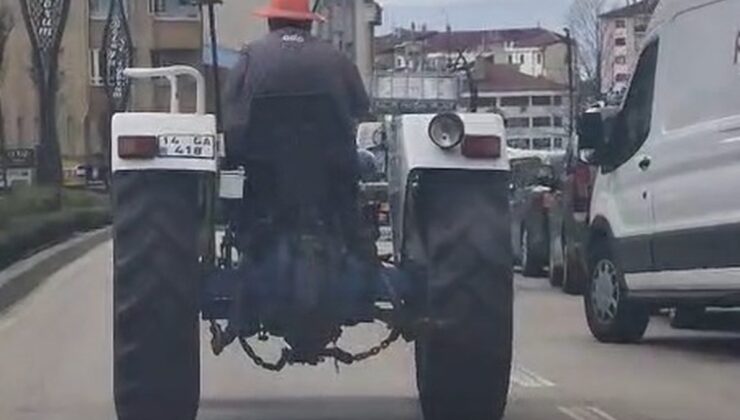 Kafasına taktığı dubayla traktörle trafikte ilerledi